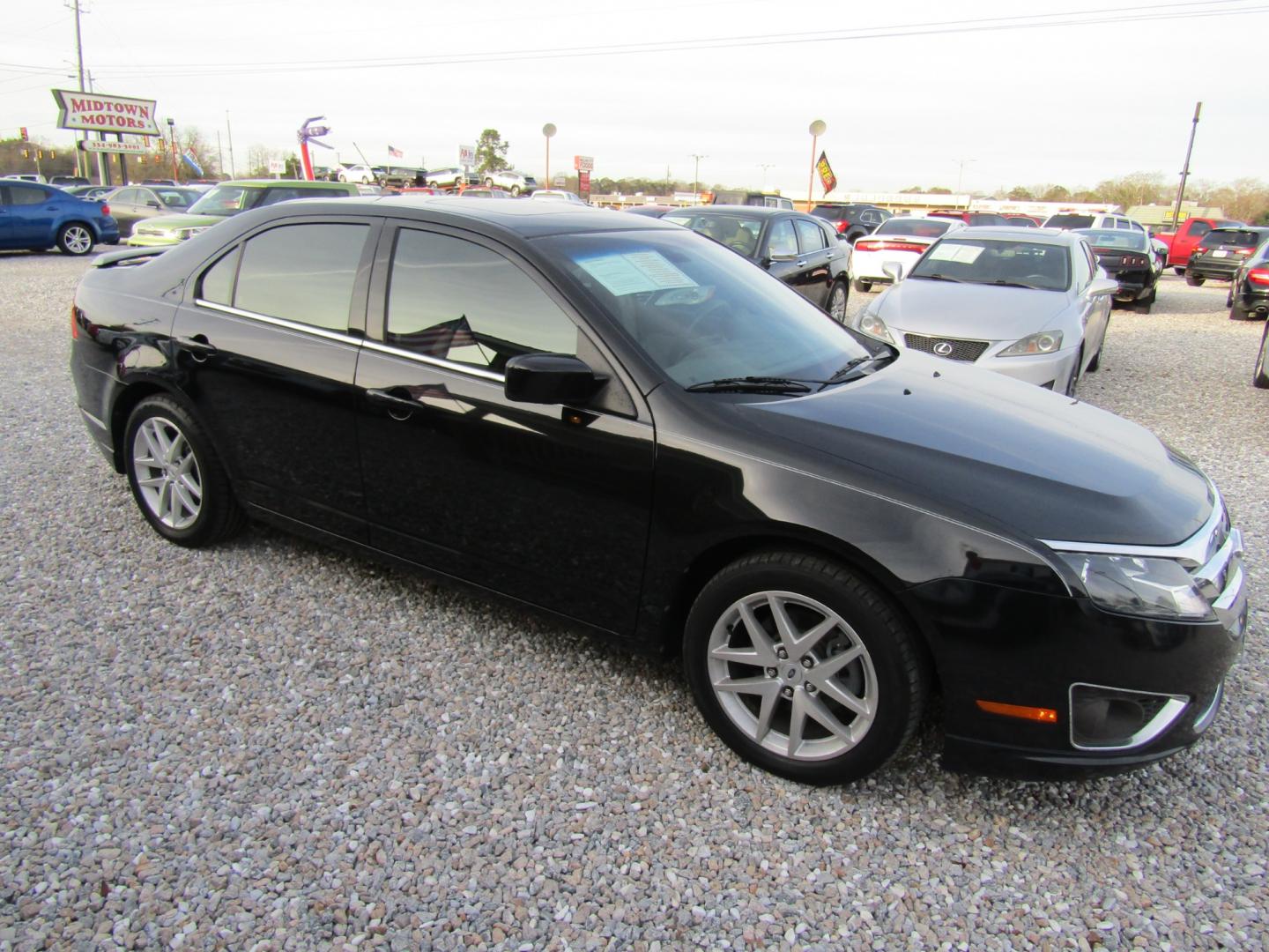 2011 Black /Tan Ford Fusion (3FAHP0JG4BR) , Automatic transmission, located at 15016 S Hwy 231, Midland City, AL, 36350, (334) 983-3001, 31.306210, -85.495277 - Photo#0